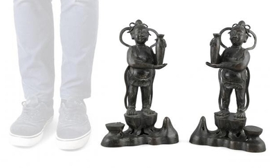 A LARGE MIRROR PAIR OF STANDING BRONZE ATTENDANTS...