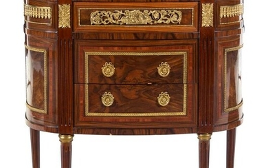 A Louis XVI Style Gilt Bronze Mounted Chest of Drawers