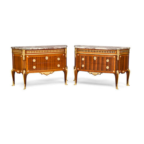 A PAIR OF LOUIS XVI STYLE MARBLE TOP GILT BRONZE MOUNTED INLAID MAHOGANY PLAQUÉ AND CONTREPLAQUÉ COMMODES