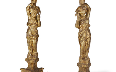 A PAIR OF NORTH EUROPEAN GILTWOOD TORCHERES EARLY 18TH CENTURY