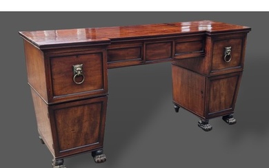 A Regency mahogany twin pedestal sideboard, the moulded top ...