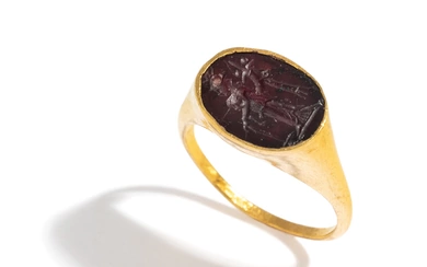 A Roman Gold and Garnet Finger Ring with the Goddess Fortuna Thyche.