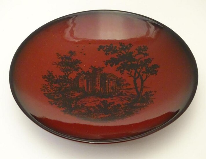 A Royal Doulton flambe dish depicting a wooded