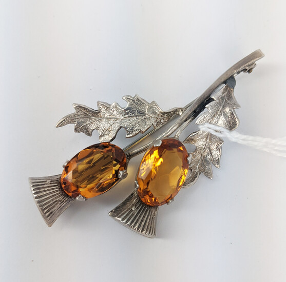 A SILVER THISTLE BROOCH