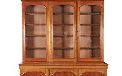 A VICTORIAN MAHOGANY THREE DOOR BOOKCASE, with moulded...