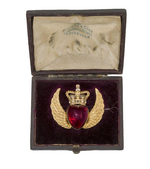 A Victorian gold, garnet, diamond and enamel brooch, of Scottish interest, modelled as winged heart, the closed-set heart shaped cabochon garnet with glazed locket reverse, to twin wings and crown surmount, the crown with old-cut diamond, garnet...