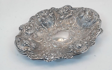 A Victorian silver dish, London, 1893, William Comyns & Sons, repousse decorated with flowers, birds and scrolling foliage, 24cm wide, 19cm deep, weight approx. 6.5oz