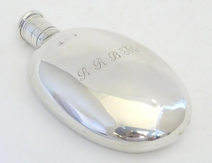 A Victorian silver hip flask of ovoid form engraved