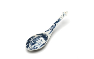 A blue and white porcelain ladle painted with landscape design