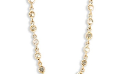 A colored diamond and fourteen karat gold necklace