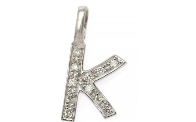 A diamond pendant in shape of the letter “K” set with numerous brilliant-cut diamonds, mounted in 18k white gold. W. 8.7 mm. H. incl. eye-let 17.8 mm.