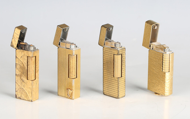 A group of four Dunhill gilt metal pocket gas lighters of various designs (some wear).
