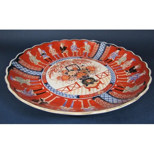 A large oriental charger in the 18th century imari style wit...