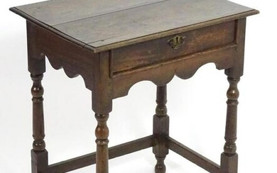 A late 17thC / early 18thC oak side table with an