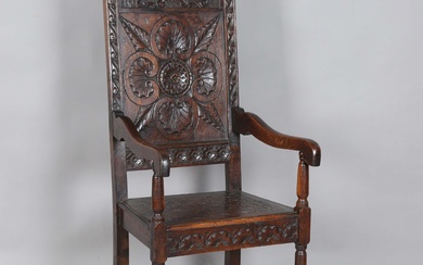 A late 19th/early 20th century Carolean Revival oak Wainscot armchair, height 115cm, width 51cm, dep