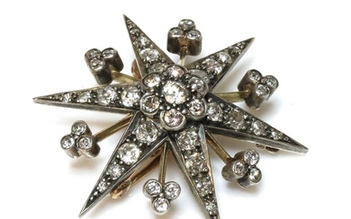A late Victorian diamond set star brooch/pendant, c.1890