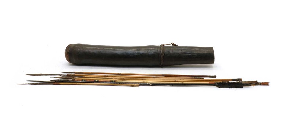 A leather Tribal quiver and nine arrows
