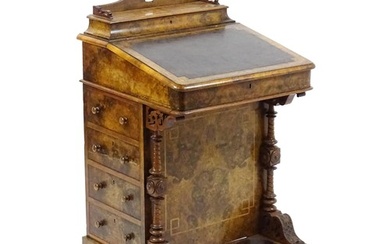 A mid / late 19thC burr walnut Davenport surmounted by a fit...