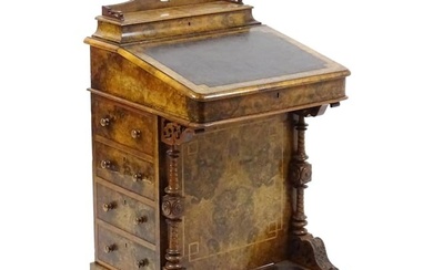 A mid / late 19thC burr walnut Davenport surmounted by a fitted writing box above a leather slope