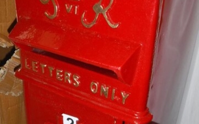 A modern vintage style red painted post box inscribed...
