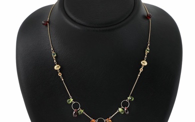 A necklace set with two carré-cut tourmalines, two circular-cut citrines and numerous...
