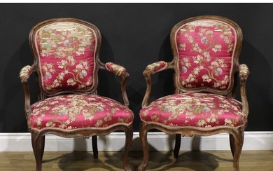 A pair of 19th century French Louis XV Revival beech fauteui...