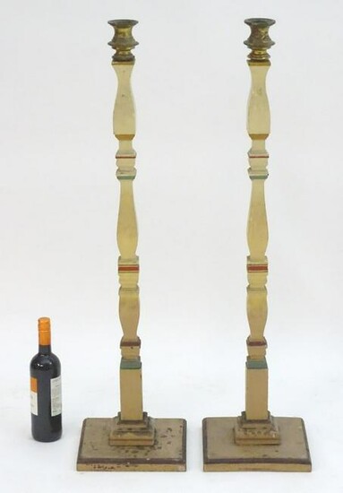 A pair of 20thC tall squared based candlesticks of