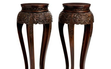 A pair of Chinese carved hardwood stands