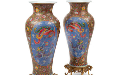 A pair of Chinese cloisonné over porcelain vases on gilt bronze stands