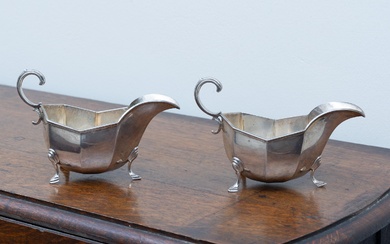 A pair of Hardy Brothers hallmarked sterling silver sauce boats, with Harrods London NSW mark to bases, London, c.1914, Height 10.5cm x Length 16cm, wt. 302g