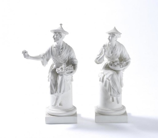 A pair of Royal Worcester biscuit porcelain Chinese figures modelled by A. Azori