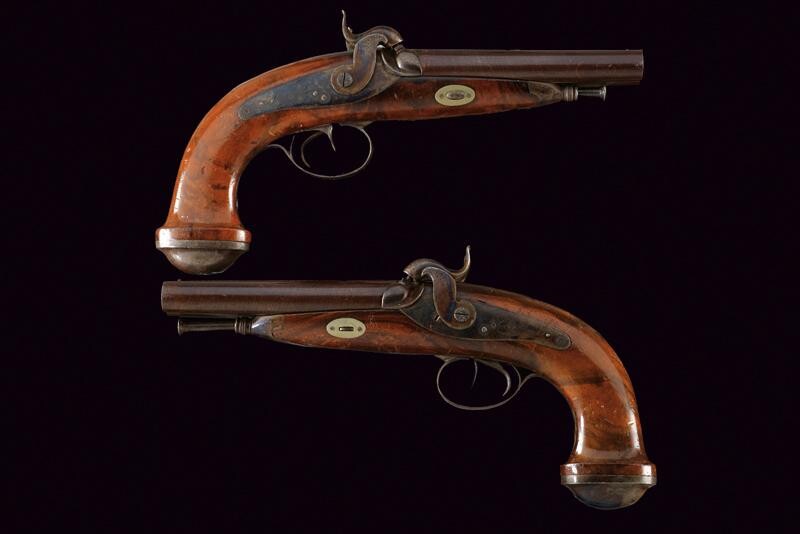 A pair of double barrelled percussion pistols by Suchet