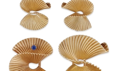 A pair of fourteen karat gold brooches and earrings...