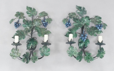 A pair of painted metal two light wall lights, circa 1970, in the form of grape vines with grapes, each 48cm high (2) It is the buyer's responsibility to ensure that electrical items are professionally rewired for use.
