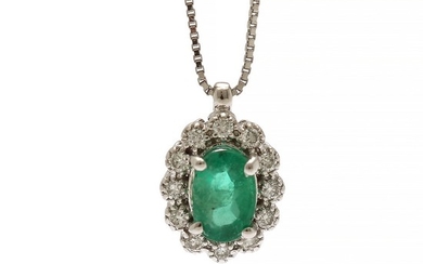 A pendant set with an emerald weighing app. 0.53 ct. encircled by numerous diamonds, totalling app. 0.12 ct., mounted in 18k white gold. L. 42 cm. (2)