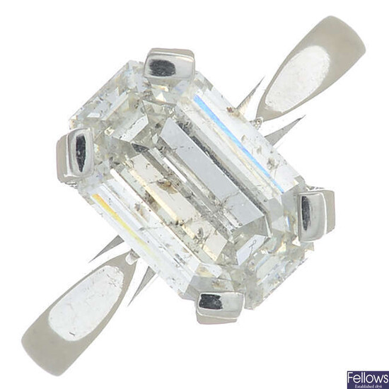 A platinum rectangular-shape diamond single-stone ring.