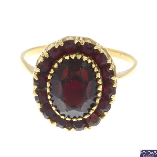 A red paste cluster ring.