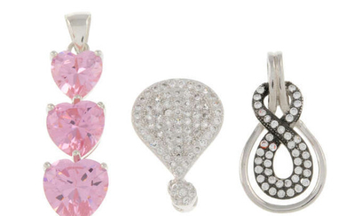 A selection of pendants, to include two lockets.