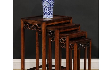 A set of Chinese hardwood quartetto tables, each with rectan...