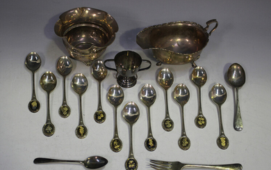A set of twelve Elizabeth II silver teaspoons, each oval terminal decorated with a different flower