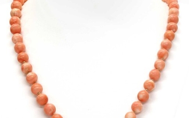 A single row uniform coral bead necklace