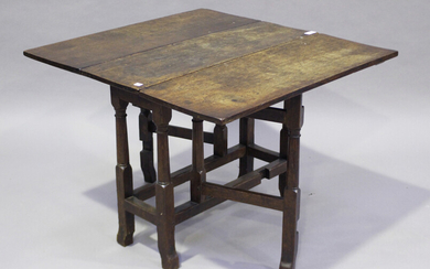A small 17th century oak rectangular gateleg occasional table, fitted with a single drawer and raise