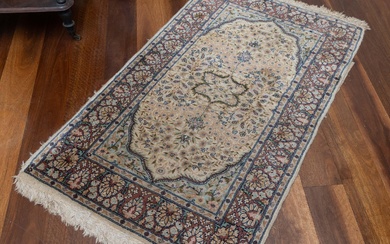 A small Persian woollen carpet with tree of life and floral motif to central niche. in muted tones. 130 x 80cm