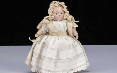 A small mid 19th century papier-mâché Taufling baby