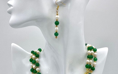 A stunning, three row necklace of alternating green jade...
