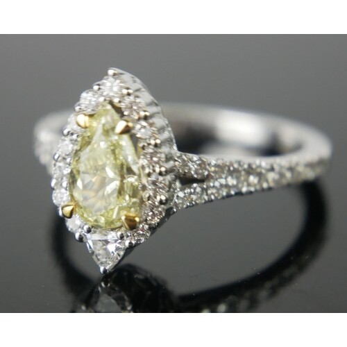 AN 14CT WHITE GOLD NATURAL YELLOW DIAMOND AND DIAMOND RING A...