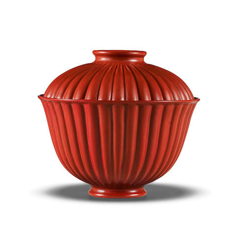 AN EXCEPTIONALLY RARE IMPERIAL RED LACQUER INSCRIBED CHRYSANTHEMUM-SHAPED BOWL AND COVER