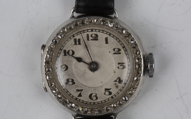 An 18ct white gold and diamond lady's dress wristwatch, the jewelled lever movement detailed