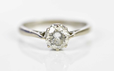 An 18ct white gold and diamond solitaire ring, the round...