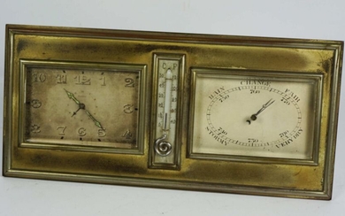 An Art Deco silvered brass cased desk alarm clock and barometer, with central thermometer, the